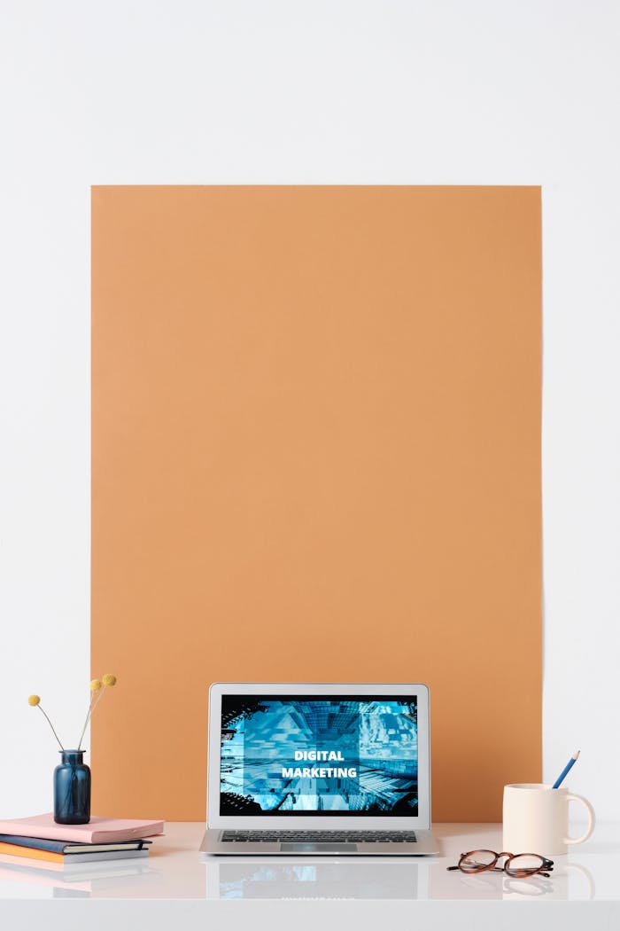 about-03 Modern workspace featuring a laptop with a digital marketing screen, ideal for business and technology themes.